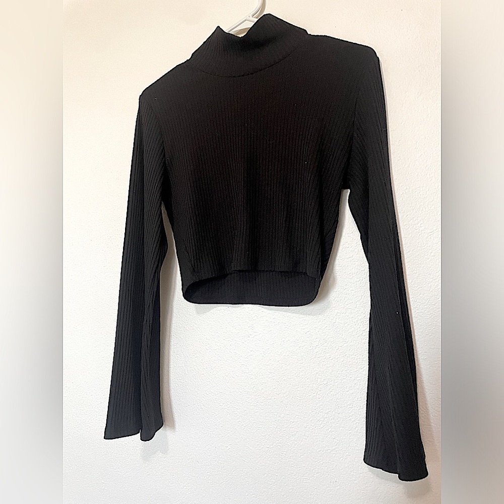 Black cropped flared long sleeved turtleneck